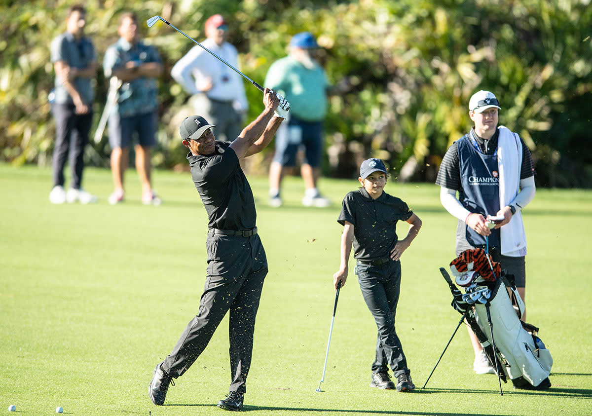 Tiger Woods hit a show as Charlie Woods watches at the 2021 PNC Championship.